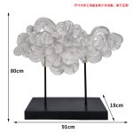 Modern minimalist hotel entrance foyer soft decoration with a high-end feel, niche transparent ornaments, resin sculptures, and artworks